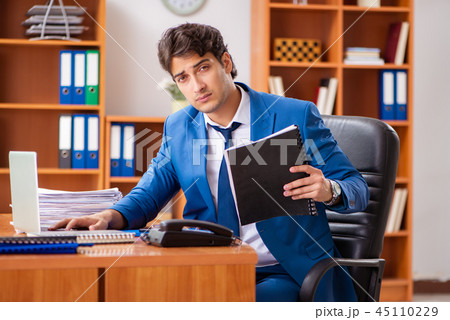 Young employee working in the office 45110229