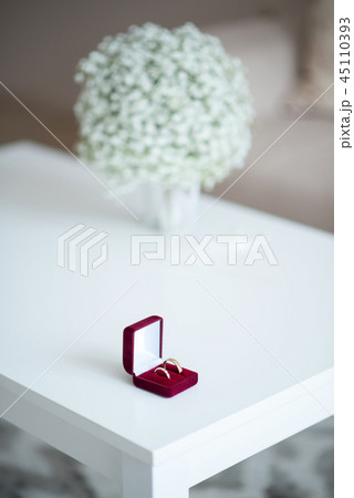 Wedding rings in a red velvet box 45110393