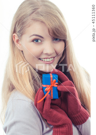 Vintage photo, Woman holding wrapped gift Vintage photo, Woman holding wrapped gift 45111360