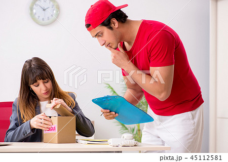 Courier delivering parcel to the office 45112581