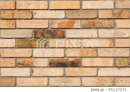 Faded brick wall background. Colored bricks facade. 45117271