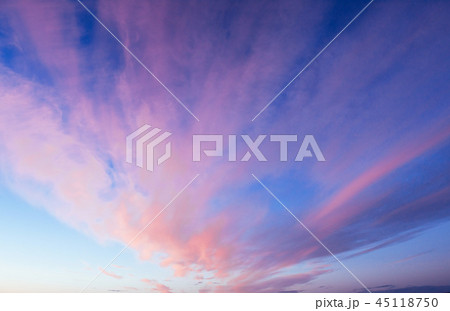 Pink orange clouds on the blue sky Pink orange clouds on the blue sky 45118750