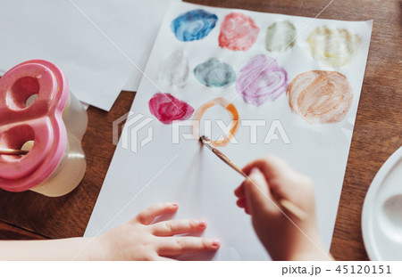 Top view of hands and brush paint watercolor  gouache 45120151
