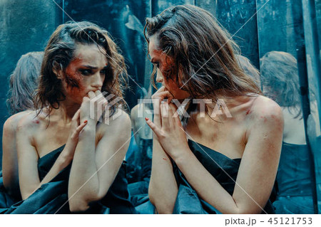 Beautiful girl with a scared face in the blood Beautiful girl with a scared face in the blood 45121753