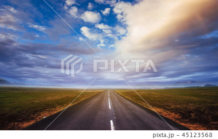 Asphalt road along the sea at sunset Iceland Asphalt road along the sea at sunset Iceland 45123568