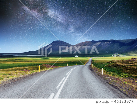 Starry Sky over the mountains. The asphalt road Starry Sky over the mountains. The asphalt road 45123977