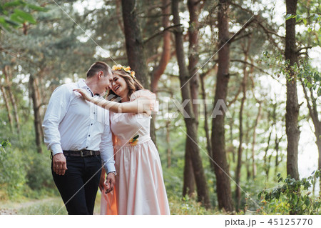 Happy couple in a pine forest Beauty world Happy couple in a pine forest Beauty world 45125770