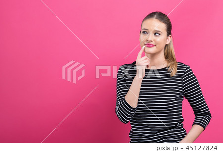 Young woman in a thoughtful pose 45127824