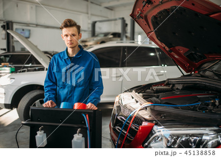 Mechanic at the air conditioning diagnostic system Mechanic at the air conditioning diagnostic system 45138858