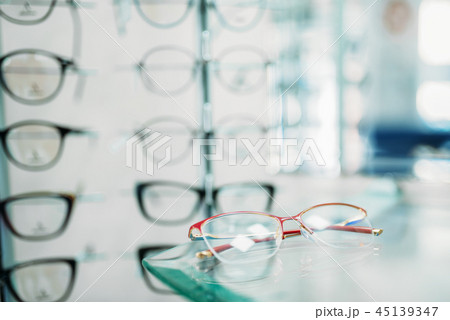 Glasses showcase in optic shop closeup, nobody Glasses showcase in optic shop closeup, nobody 45139347