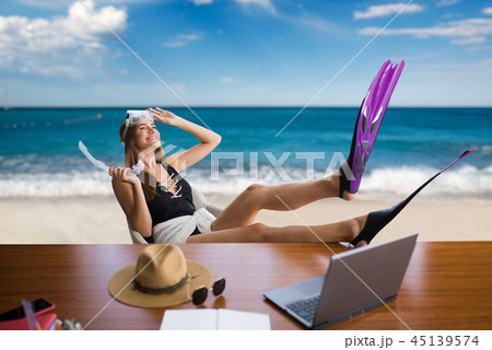 Woman in flippers at table, dreams about vacation Woman in flippers at table, dreams about vacation 45139574