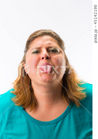 Close-up of woman showing her tongue 45142190