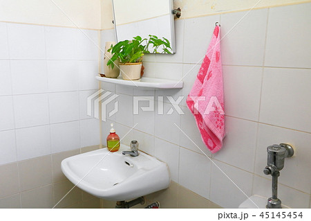 red towel for wipe hand in toliet room on wall red towel for wipe hand in toliet room on wall 45145454
