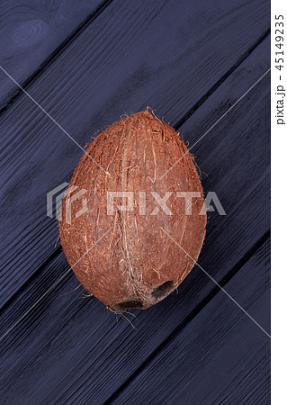 Fresh whole coconut fruit, top view. 45149235