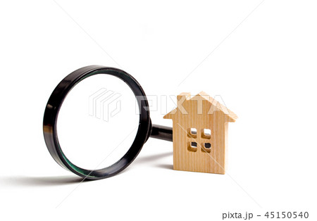 Wooden house and magnifying glass  45150540