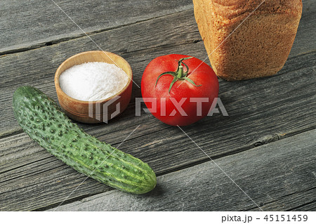 Bread, salt, cucumber and tomato Bread, salt, cucumber and tomato 45151459