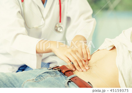 Woman Doctor and Male Patient in Hospital Office Woman Doctor and Male Patient in Hospital Office 45159375