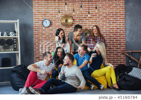 Group portrait of multi-ethnic boys and girls with colorful fashionable clothes holding friend Group portrait of multi-ethnic boys and girls with colorful fashionable clothes holding friend 45160784