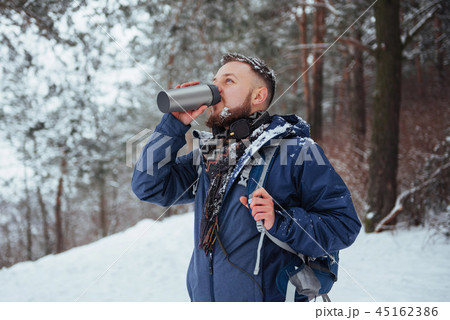 Man Traveler with backpack hiking Travel Lifestyle adventure concept active vacations outdoor 45162386