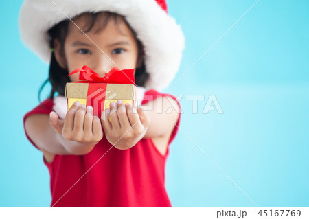 Cute asian child girl holding beautiful gift 45167769