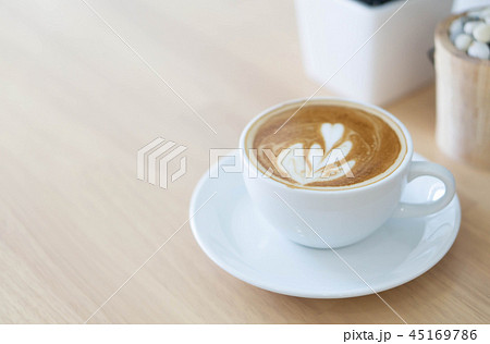 Closeup glass of latte art coffee tulip shape 45169786
