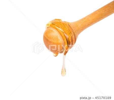 Honey dripping isolated on white background 45170189