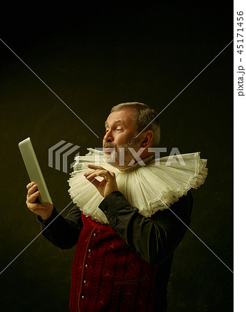 Official portrait of historical governor from the golden age. Studio shot against dark wall. Official portrait of historical governor from the golden age. Studio shot against dark wall. 45171456