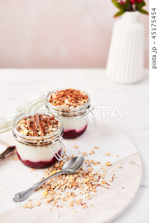 Healthy yogurt with strawberry sauce and oat Healthy yogurt with strawberry sauce and oat 45175454