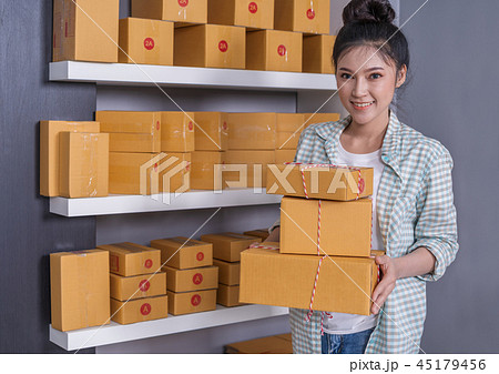 woman entrepreneur with parcel boxes woman entrepreneur with parcel boxes 45179456