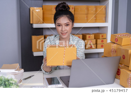 woman entrepreneur with parcel boxes  45179457