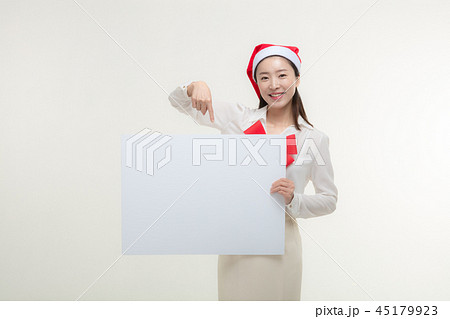 Christmas Day. Korea woman holding a white card Christmas Day. Korea woman holding a white card 45179923