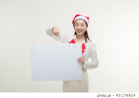 Christmas Day. Korea woman holding a white card Christmas Day. Korea woman holding a white card 45179924