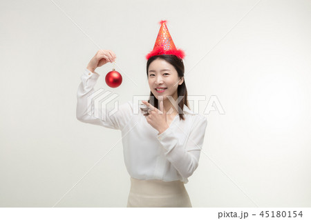 Christmas Day. Korea woman holding xmas props Christmas Day. Korea woman holding xmas props 45180154
