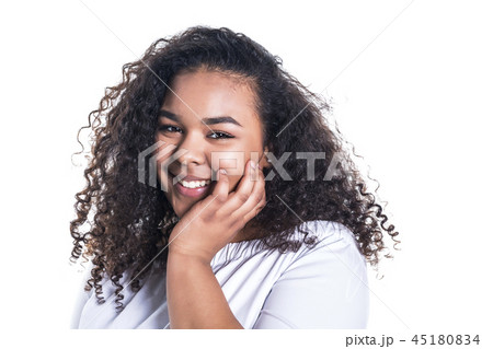 Beautiful young african woman posing isolated over white 45180834