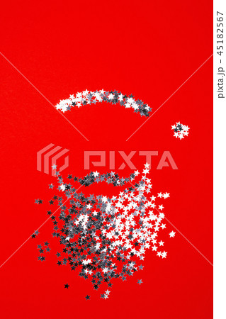 Beard and hat of Santa Claus on red bacground. Beard and hat of Santa Claus on red bacground. 45182567
