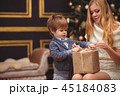 Mom and son near the Christmas tree 45184083