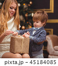 Mom and son near the Christmas tree 45184085