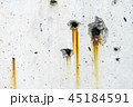 Rusty metal staining on white concrete surface 45184591