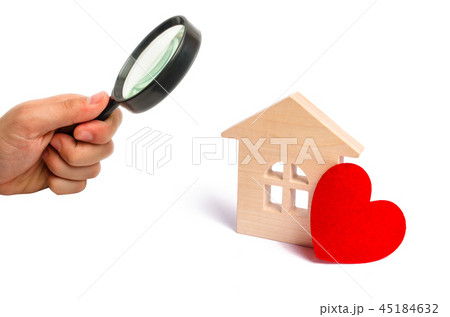 Magnifying glass is looking at the Wooden house Magnifying glass is looking at the Wooden house 45184632