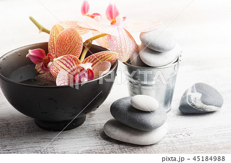Spa still life with pebbles and red orange orchid Spa still life with pebbles and red orange orchid 45184988