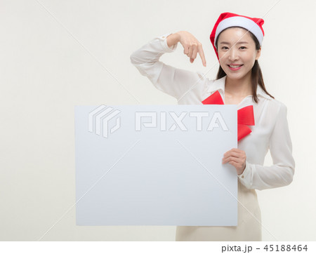 Christmas Day. Korea woman holding a white card Christmas Day. Korea woman holding a white card 45188464