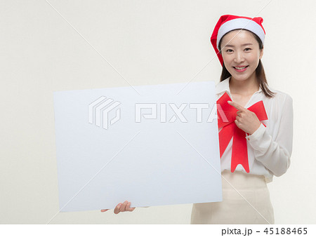 Christmas Day. Korea woman holding a white card Christmas Day. Korea woman holding a white card 45188465