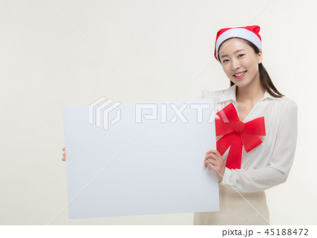 Christmas Day. Korea woman holding a white card Christmas Day. Korea woman holding a white card 45188472