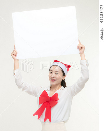 Christmas Day. Korea woman holding a white card Christmas Day. Korea woman holding a white card 45188477