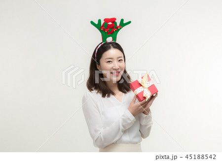 Christmas Day. Korea woman holding xmas props Christmas Day. Korea woman holding xmas props 45188542