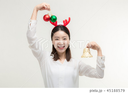 Christmas Day. Korea woman holding xmas props Christmas Day. Korea woman holding xmas props 45188579