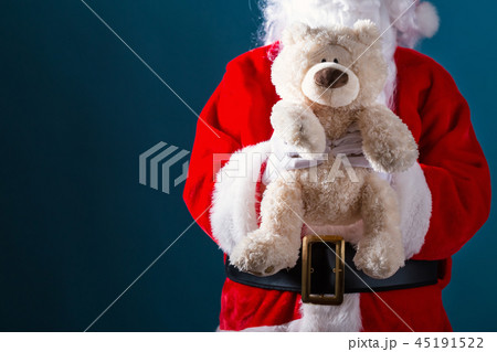 Santa holding a teddy bear Santa holding a teddy bear 45191522