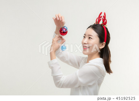 Christmas Day. Korea woman holding xmas props 45192525