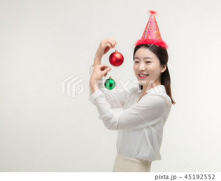 Christmas Day. Korea woman holding xmas props Christmas Day. Korea woman holding xmas props 45192552