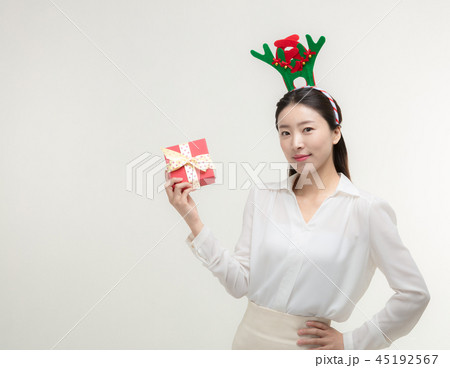 Christmas Day. Korea woman holding xmas props 45192567